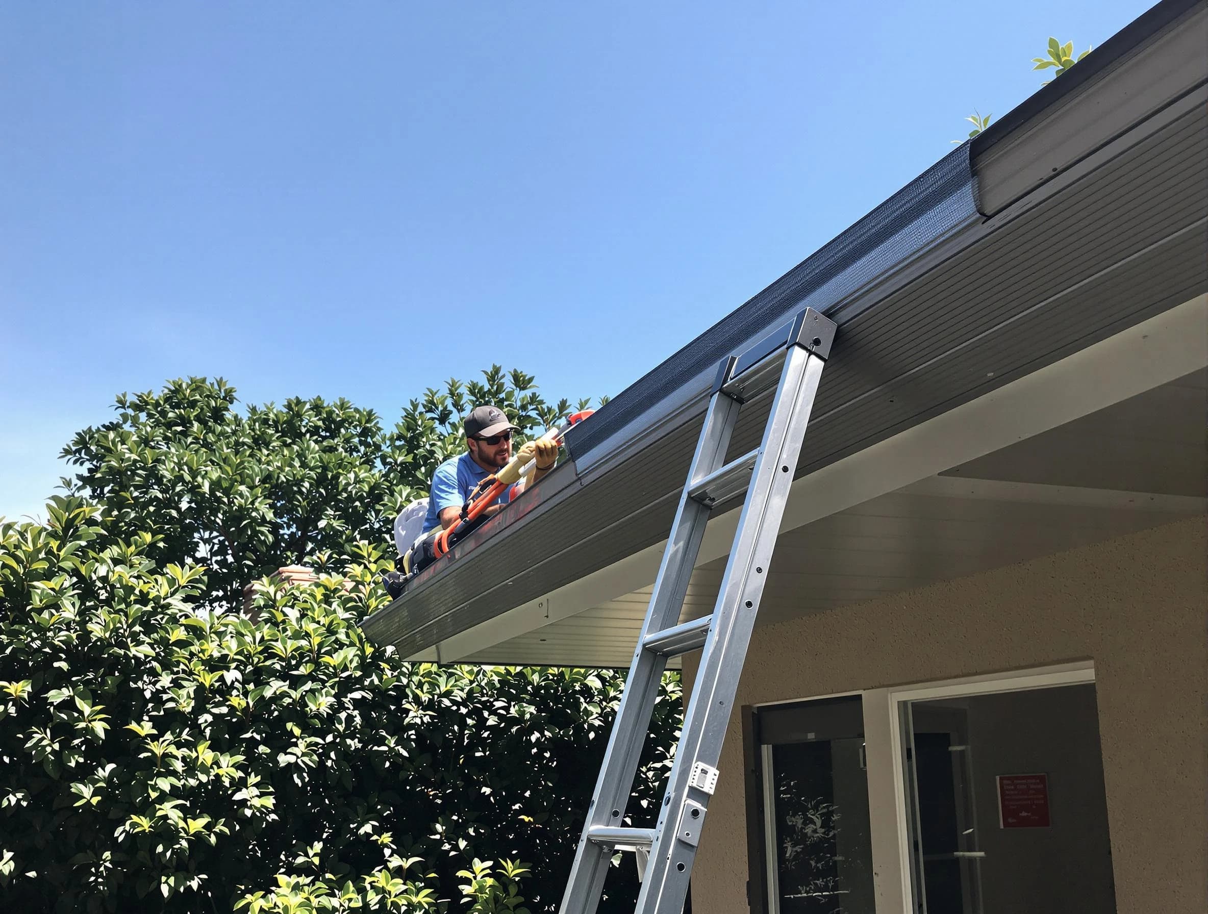 Cuyahoga Falls Roofing Company installing gutter guards for a homeowner in Cuyahoga Falls, OH